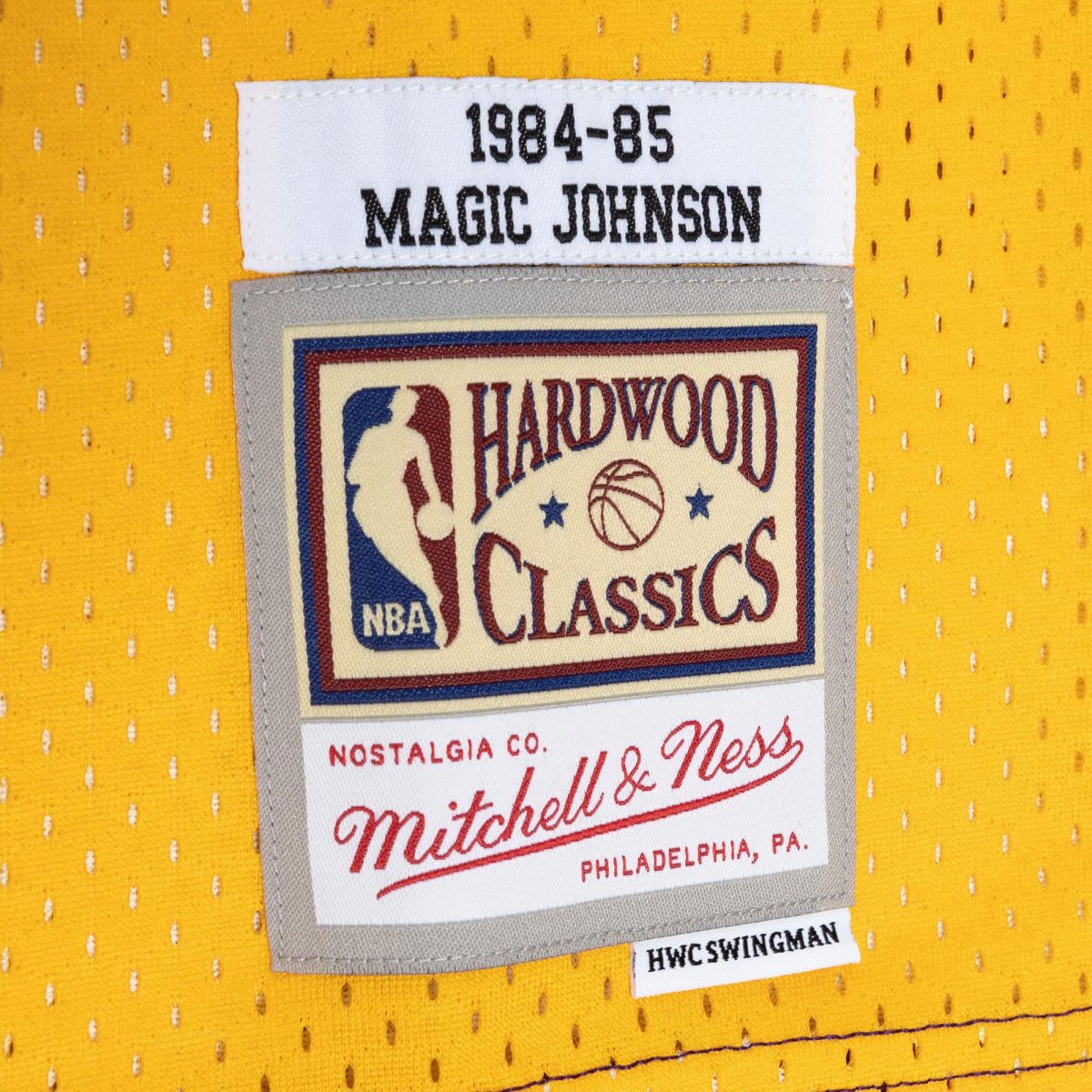 Official Los Angeles Lakers mens magic johnson magic johnson mitchell  ness purplegold hardwood classics 198485 split swingman jersey | Lakers Shop