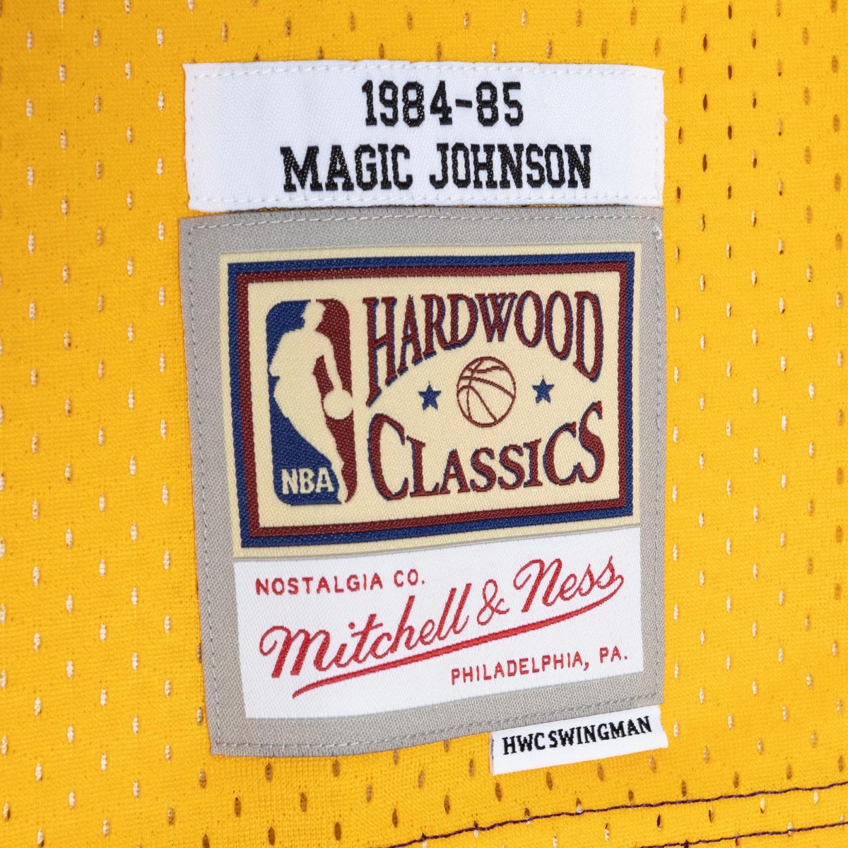 Official Los Angeles Lakers mens magic johnson magic johnson mitchell  ness purplegold hardwood classics 198485 split swingman jersey | Lakers Shop
